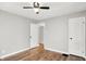 The bedroom has a ceiling fan, neutral paint, hardwood flooring and two closets at 1722 Dawson St, Indianapolis, IN 46203