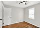 This bedroom has a closet, window, and wood floors at 1722 Dawson St, Indianapolis, IN 46203