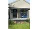 Inviting front porch with blue Adirondack chairs and charming decor at 1722 Dawson St, Indianapolis, IN 46203