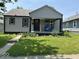 Charming one-story home featuring a welcoming front porch and well-maintained landscaping at 1722 Dawson St, Indianapolis, IN 46203