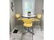 Cozy eat-in kitchen with sleek yellow bar stools and natural light at 1722 Dawson St, Indianapolis, IN 46203
