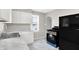 Updated kitchen offering white cabinets, marble countertops, and stainless steel appliances at 1722 Dawson St, Indianapolis, IN 46203