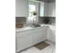 Bright and modern kitchen featuring a stainless steel sink and white cabinets at 1722 Dawson St, Indianapolis, IN 46203