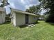 Cozy home with siding and a modest lawn, under a partly cloudy sky at 1730 N Graham Ave, Indianapolis, IN 46218