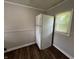 Kitchen featuring a white refrigerator and a window bringing in natural light at 1730 N Graham Ave, Indianapolis, IN 46218