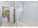 Bathroom with a tub and shower combo next to the open door to the main bedroom at 1854 Oconnor Ct, Avon, IN 46123