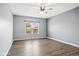 Spacious bedroom boasts wood-look floors and a large window overlooking the front yard at 1854 Oconnor Ct, Avon, IN 46123