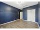 Navy bedroom features wood-look floors and closet access at 1854 Oconnor Ct, Avon, IN 46123