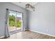Bright dining area with sliding glass door leading to the backyard and modern light fixture at 1854 Oconnor Ct, Avon, IN 46123