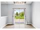 Cozy dining area with sliding glass door leading to the backyard and a modern light fixture at 1854 Oconnor Ct, Avon, IN 46123