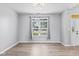 This room features a large window that provides ample natural light and wood-look flooring at 1854 Oconnor Ct, Avon, IN 46123