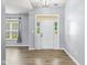 Bright foyer features a glass front door and sidelights, flooding the space with natural light at 1854 Oconnor Ct, Avon, IN 46123