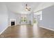 Open-concept living room with fireplace, ceiling fan, and lots of space for entertaining at 1854 Oconnor Ct, Avon, IN 46123