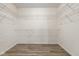 Spacious walk-in closet features metal shelving and wood-look floors at 1854 Oconnor Ct, Avon, IN 46123