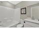 Clean and modern bathroom with white fixtures, a tub-shower combo, and contemporary design at 19843 Moorpark Lndg, Noblesville, IN 46062
