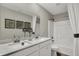 Bright bathroom featuring double sinks with quartz countertop, framed mirror, and shower/tub combination at 19843 Moorpark Lndg, Noblesville, IN 46062