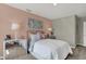 Well-lit bedroom with a stylish bed, decorative pillows, and modern décor at 19843 Moorpark Lndg, Noblesville, IN 46062