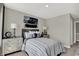Stylish bedroom features a cozy bed, decorative art, and ample lighting at 19843 Moorpark Lndg, Noblesville, IN 46062