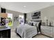 Nicely-decorated bedroom with a comfortable bed, decorative artwork, and dresser at 19843 Moorpark Lndg, Noblesville, IN 46062