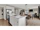 Island view of a open kitchen with stainless steel appliances and view to Gathering room at 19843 Moorpark Lndg, Noblesville, IN 46062
