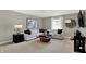 Comfortable living room featuring neutral colors, a large sofa, and contemporary decor at 19843 Moorpark Lndg, Noblesville, IN 46062