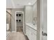Main bathroom offers a double sink vanity, a glass enclosed shower, and access to a walk-in closet at 19843 Moorpark Lndg, Noblesville, IN 46062