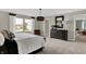 Comfortable main bedroom boasts a neutral color palette and ample natural light at 19843 Moorpark Lndg, Noblesville, IN 46062