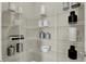 Organized pantry with white wire shelving and decorative kitchenware for a stylish look at 19843 Moorpark Lndg, Noblesville, IN 46062
