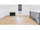 Open attic space with laminate floors, natural light, and iron railings at 201 N 11Th St, Elwood, IN 46036