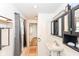 Hall bathroom with pedestal sink and linen closet at 201 N 11Th St, Elwood, IN 46036