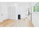 Bright bedroom features laminated wood floors, closet, and a connected bathroom at 201 N 11Th St, Elwood, IN 46036