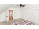 Cozy bedroom with a doorway, neutral carpet, and a window for natural light at 201 N 11Th St, Elwood, IN 46036
