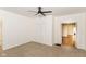 Bedroom featuring a ceiling fan, neutral carpet, and closet at 201 N 11Th St, Elwood, IN 46036