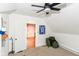 Bedroom with a ceiling fan, interior door, and backpacks on a carpeted floor at 201 N 11Th St, Elwood, IN 46036