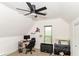 Cozy bedroom with a ceiling fan, a window, and a desk with a computer at 201 N 11Th St, Elwood, IN 46036
