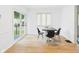 Bright dining room with modern furniture and a sliding glass door at 201 N 11Th St, Elwood, IN 46036