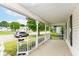 An inviting front porch with decorative railings offering a pleasant neighborhood view at 201 N 11Th St, Elwood, IN 46036