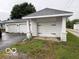 Detached two-car garage with white brick pillars and a driveway at 201 N 11Th St, Elwood, IN 46036
