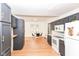 Eat-in kitchen with dining area, stainless appliances, and black cabinets at 201 N 11Th St, Elwood, IN 46036