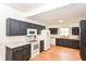 Modern kitchen with sleek cabinetry, stainless steel appliances, and hardwood floors at 201 N 11Th St, Elwood, IN 46036