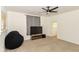 Bright living room with a ceiling fan and large window at 201 N 11Th St, Elwood, IN 46036