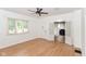 Well-lit living area showcases hardwood floors and leads to more rooms at 201 N 11Th St, Elwood, IN 46036