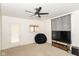 Living room featuring a ceiling fan, neutral carpet, and large window at 201 N 11Th St, Elwood, IN 46036