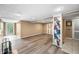 Open basement showcasing hardwood floors, a set of wall-mounted bookshelves, and neutral paint at 242 W Warford Dr, , IN 46164