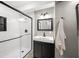 Updated bathroom with a glass shower, modern vanity, and minimalist design at 242 W Warford Dr, , IN 46164