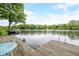 Relaxing dock view featuring a quaint seating area by the water, perfect for enjoying lakeside tranquility at 242 W Warford Dr, , IN 46164