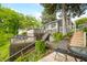 Backyard featuring a tiered wooden deck with outdoor seating and a hot tub, perfect for relaxation at 242 W Warford Dr, , IN 46164