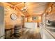 Rustic kitchen featuring wood walls, cabinetry, and unique barrel table for dining at 242 W Warford Dr, , IN 46164
