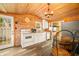 Cozy kitchen with wood paneling, white cabinets, and stainless steel appliances at 242 W Warford Dr, , IN 46164