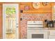 Well-lit kitchen area highlighting cabinets, appliances, and colorful backsplash at 242 W Warford Dr, , IN 46164
